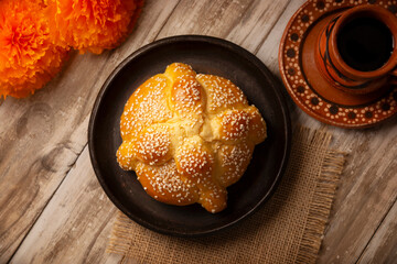 Pan de Muerto. Typical Mexican sweet bread that is consumed in the season of the day of the dead. It is a main element in the altars and offerings in the festivity of the day of the dead.