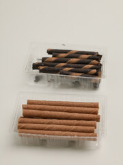 Biscuit sticks or rolled biscuits on white background