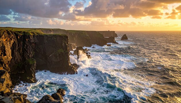 Dramatic sunset over rugged coastal cliffs with crashing waves and a lighthouse in the distance