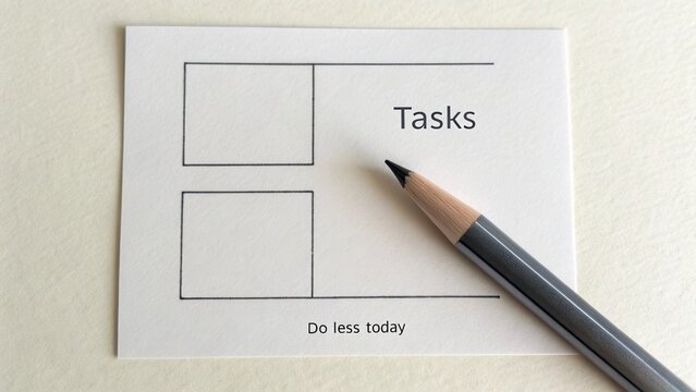 Simple task management card with empty checkboxes for daily planning and motivational phrase encouraging productivity