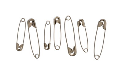 metal safety pins isolated on white