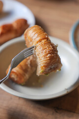 Delicious baklava served on a plate with fork