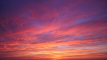 Fototapeta premium Vivid colorful sunset sky with stunning pink, purple, and orange clouds creating a dramatic natural gradient, symbolizing beauty, peace, evening atmosphere, and breathtaking nature background for desi