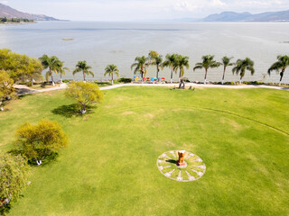 Scenic aerial panoramic shot of Jocotepec malecon and waterfront on Lake Chapala in Jalisco Mexico