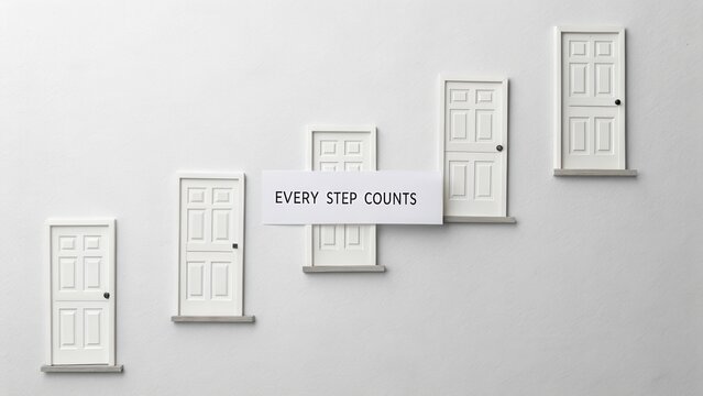 Staircase of Small Doors Symbolizing Life Journey and Progress with Motivational Text Every Step Counts
