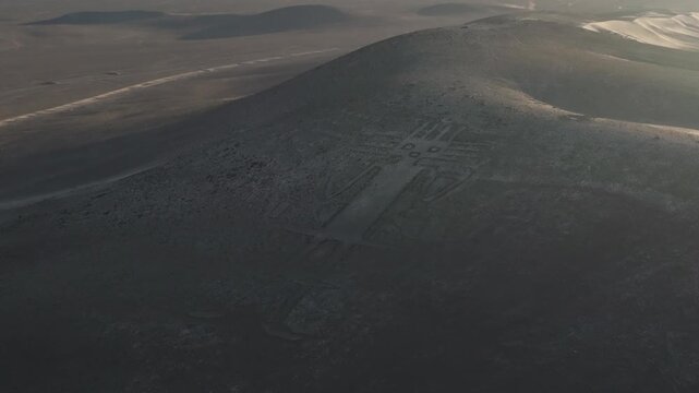 Giant of Tarapaca geoglyph seen from above in the vast Chilean desert terrain