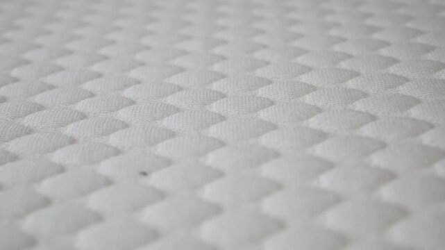 Soft texture of a mattress under close examination