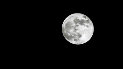 Obraz premium A classic black and white image of a moon with intense, dramatic lighting and high contrast, evoking tension, presented in a timeless and elegant style