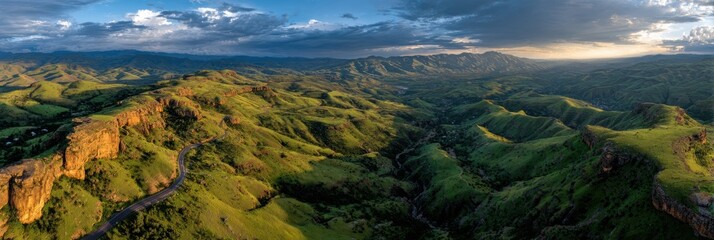Stunning View of Rolling Green Hills Under a Dramatic Sky at Sunset