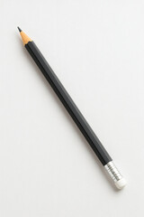 Black Graphite Pencil on White Paper Surface