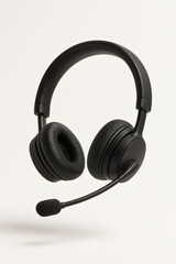 Black Headset with Microphone Isolated on Beige Background