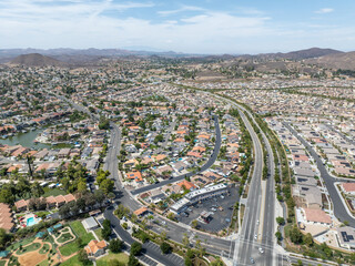 Aerial view of a sprawling neighborhood of family homes in Menifee city in Riverside County, California, United States