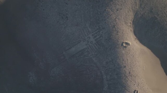 Giant of Tarapaca geoglyph seen from above in the vast Chilean desert terrain