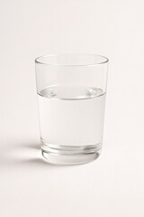 Glass Half Full of Water on White Background