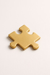 Single Golden Puzzle Piece on White Background