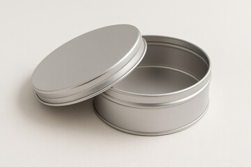 Open Round Metal Tin on Beige Background