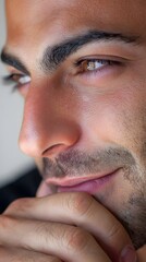 Obraz premium Close up profile of a handsome thoughtful man looking away.