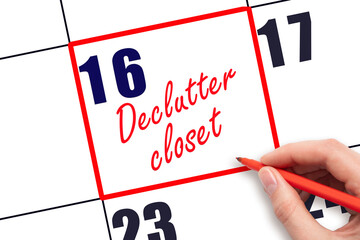 16 th day of the month. Hand writing Declutter closet reminder and drawing red frame on calendar with red pen on white background. Cleaning concept. Planning and scheduling.