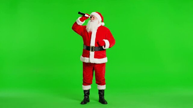 Santa Claus Looks Through Telescope on Green Screen.