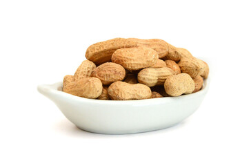 Dried peanuts in closeup on white