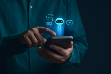 Businessman using mobile phone with virtual chatbot icon. AI technology, virtual assistant, customer service automation and digital communication innovation concept