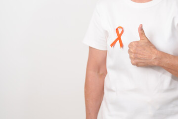 Elderly with Orange Ribbon for September Leukemia, March Kidney cancer day, Multiple Sclerosis, November Complex Regional Pain Syndrome, CRPS, COPD, Chronic Obstructive Pulmonary disease concepts