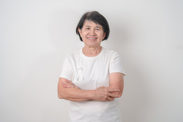 Elderly with White ribbon for concept November Lung Cancer Awareness month, Stop Violence Against...