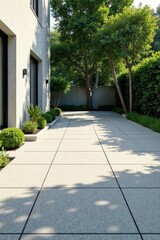 Fototapeta premium Modern home exterior design showcasing a sun-drenched patio with meticulously landscaped greenery and light-colored paving stones