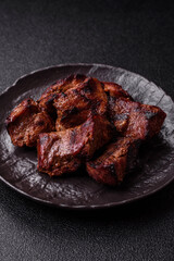 Beef, grilled meat in pieces, or kebab with sauce and vegetables. Beef in pieces