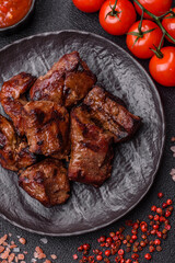 Beef, grilled meat in pieces, or kebab with sauce and vegetables. Beef in pieces
