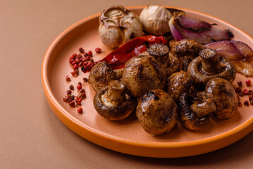 Grilled mushroom pieces, a vegetarian healthy meal with sauce. Barbecue mushroom halves