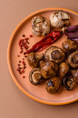 Grilled mushroom pieces, a vegetarian healthy meal with sauce. Barbecue mushroom halves