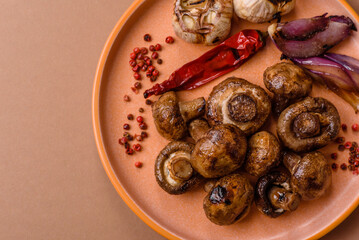 Fototapeta premium Grilled mushroom pieces, a vegetarian healthy meal with sauce. Barbecue mushroom halves