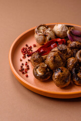 Grilled mushroom pieces, a vegetarian healthy meal with sauce. Barbecue mushroom halves
