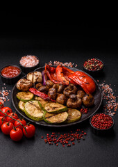 Grilled vegetables, bell peppers, mushrooms, and zucchini, a vegetarian meal. Grilled vegetables