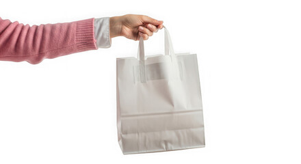 Hand holding a white paper shopping bag isolated on transparent background