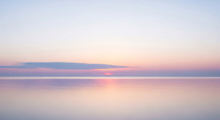 Gentle sunrise over the tranquil sea, casting a soft pink and purple hue across the water and sky, creating a serene and peaceful atmosphere at dawn