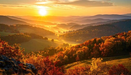 Naklejka premium Sunrise Over Rolling Hills With Autumn Foliage in Golden Light Natural Landscape Mountain Range Scenic View With Foggy Valleys And Vibrant Color