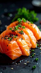 Close-up of sliced salmon sashimi.  Fresh, vibrant orange-pink salmon slices sit on a dark surface, garnished with black sesame seeds and green herbs