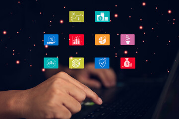 Investor using a laptop to manage a digital financial portfolio. The futuristic fintech interface displays icons for stock market analysis, currency exchange, investment growth, and security.