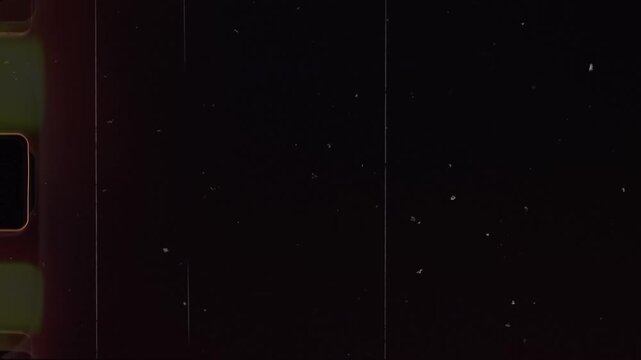Dust and scratches with film light leaks and noise effects. Analog vintage video background overlay.