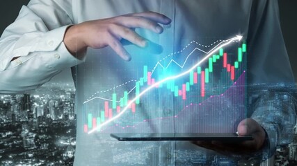 A business professional holds a tablet displaying futuristic graphics of data trends and stock market projections, showcasing urban insight and analysis at night. Copula - Powered by Adobe