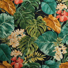 Tropical leaves, green foliage, orange and red flowers, and yellow blossoms create vibrant, lush botanical pattern on dark background, evoking lively, exotic atmosphere