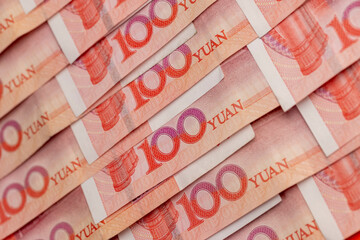 number 100 on Chinese yuan, Chinese red money folded together, a large amount of money is the Chinese national currency