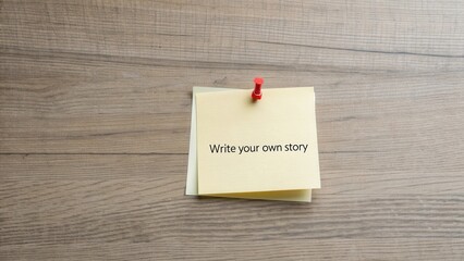 Blank sticky note pinned to wooden surface with motivational text encouraging creativity and self-expression in storytelling