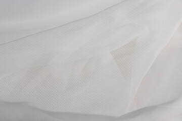 Fototapeta premium fabric for making curtains close up, finely woven synthetic threads for making tulle for windows in the home