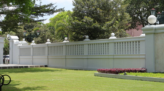 A sturdy and beautiful concrete fence is located in front of the office of the governor of the special region of Yogyakarta.
