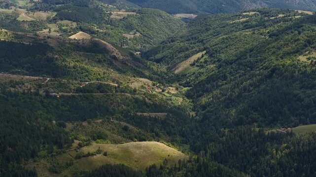 Green Mountain Hills Under Clouds Shadows on Summer Day, Green Forest and Village on Zlatibor Mountain, Serbia