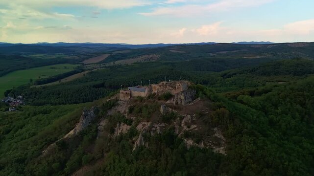 Orbital drone hyperlapse around the Castle of Sirok with the beautiful M&aacute;tra Mountains around in Hungary.