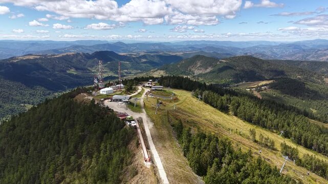 Aerial View of Tornik Peak, Zlatibor Mountain, Serbia, Gondola and Ski Lift, Communication Towers and Landscape on Sunny Summer Day